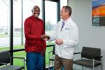 Man Shaking Hands With Doctor