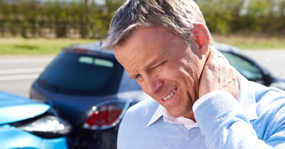 Man Holding Neck After Car Accident
